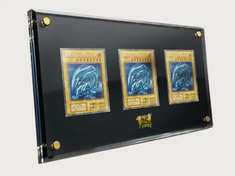 Three Blue-Eyes White Dragon cards (Secret Rare), framed in a display case